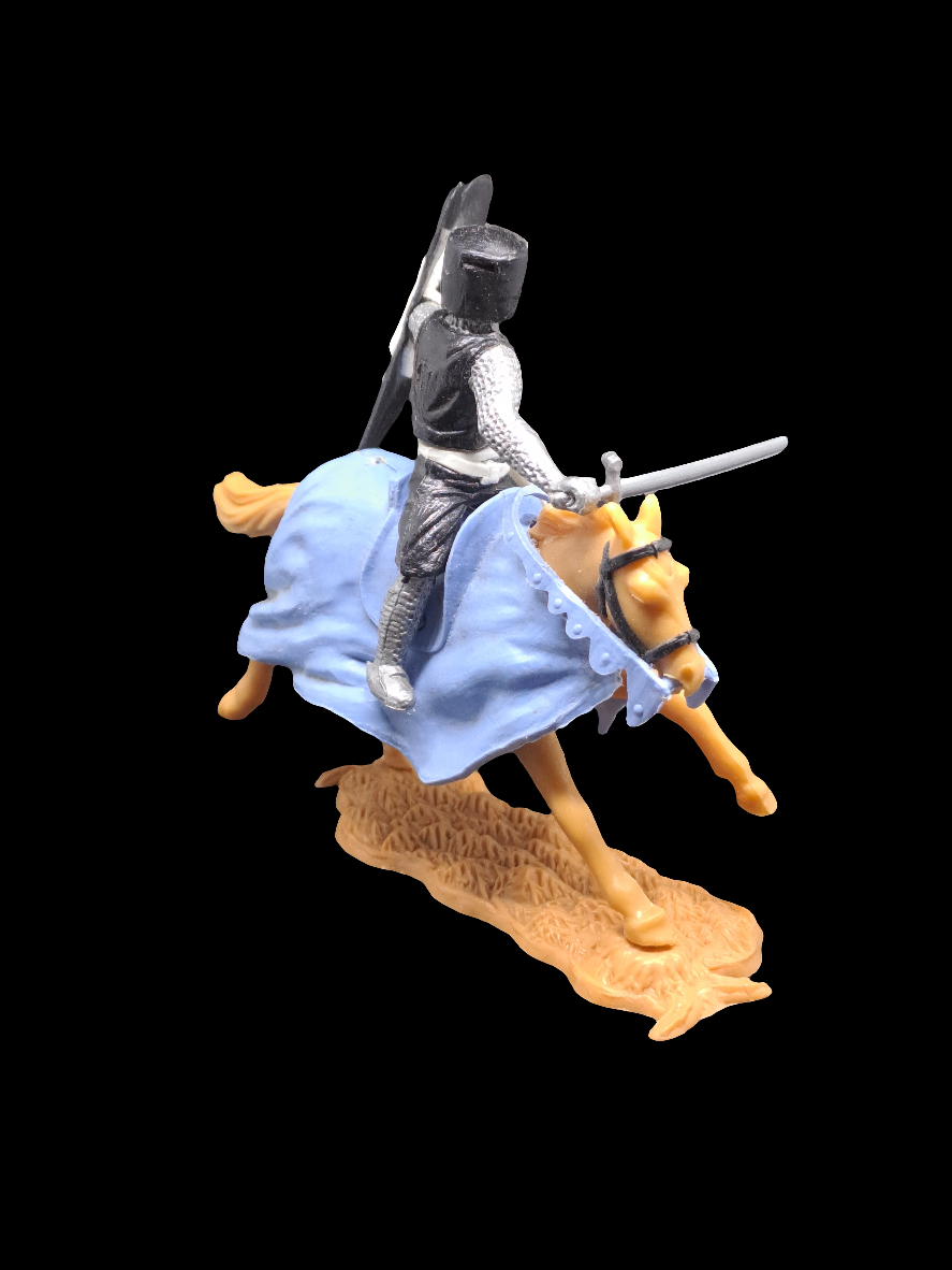 Knight on horse with sword and shield.