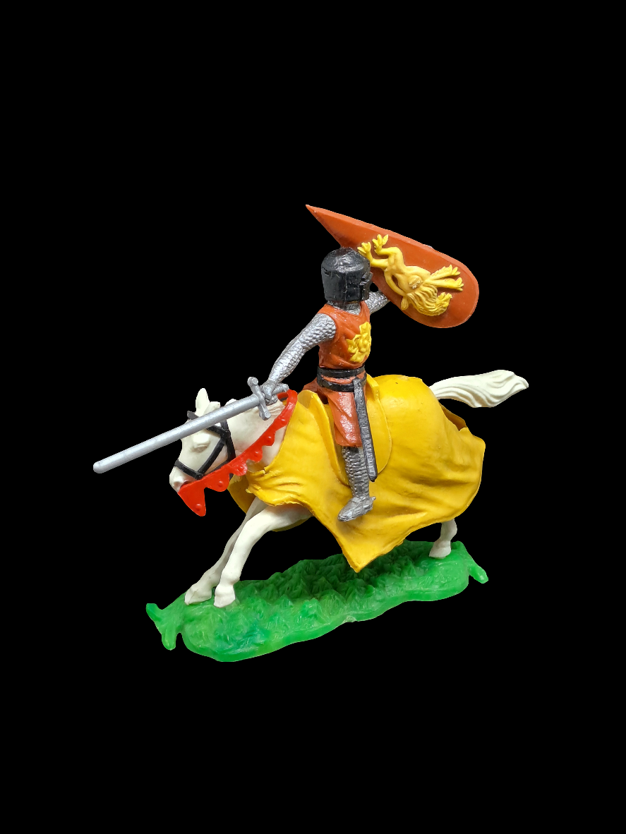 Knight on horse with sword and shield.