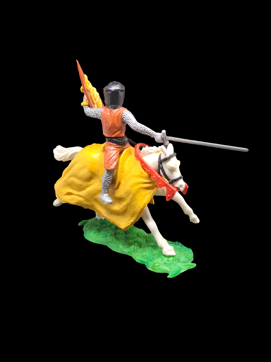 Knight on horse with sword and shield.