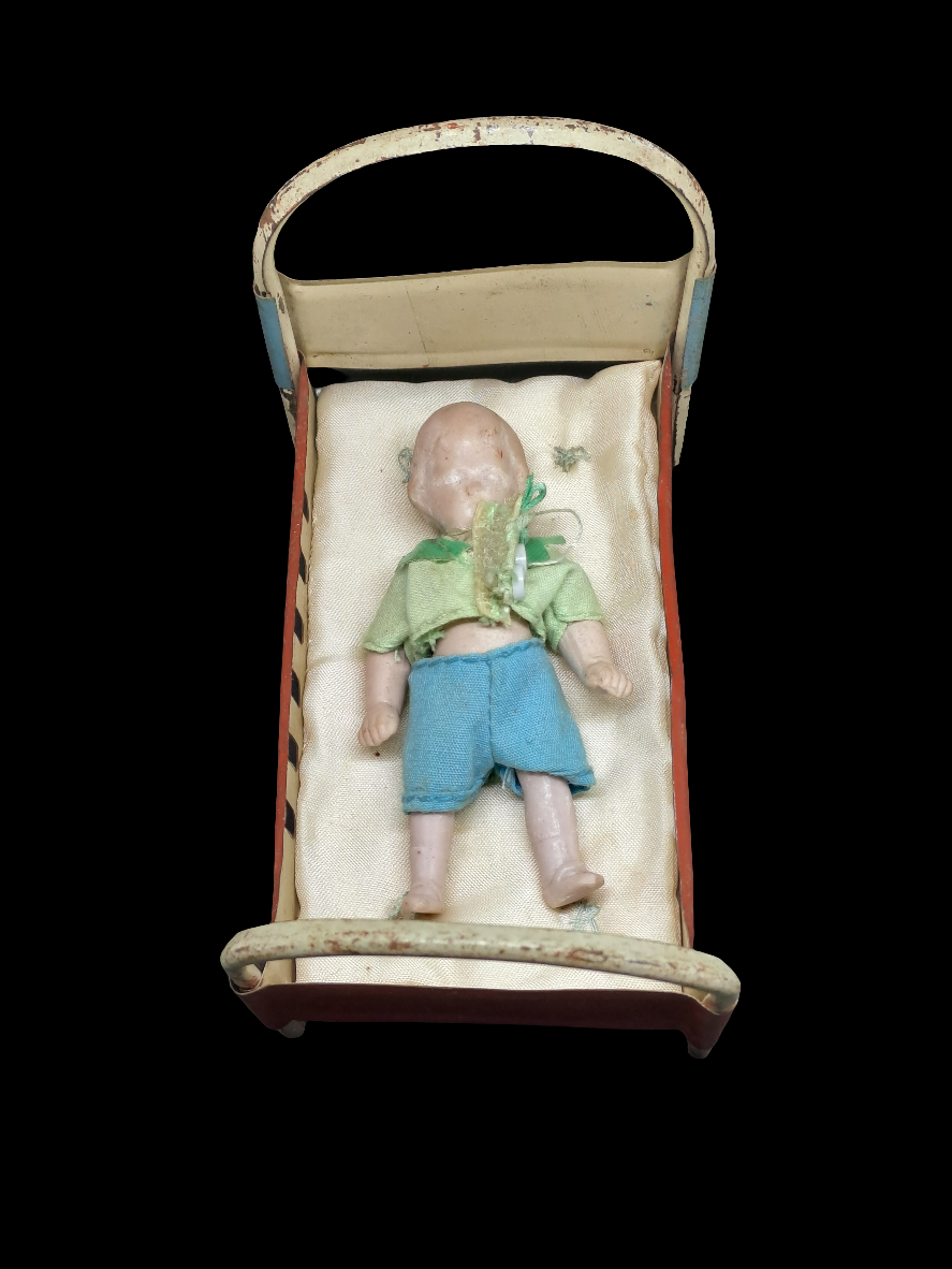 Busquit doll in bed